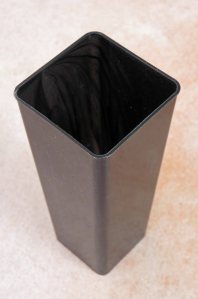 Typioal square pot used to grow trees for reforestation in Australia.