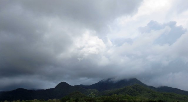 A common sight all around the world - cloud formation on the top of a hill or mountain. Near Edmonton, Cairns, Australia. 